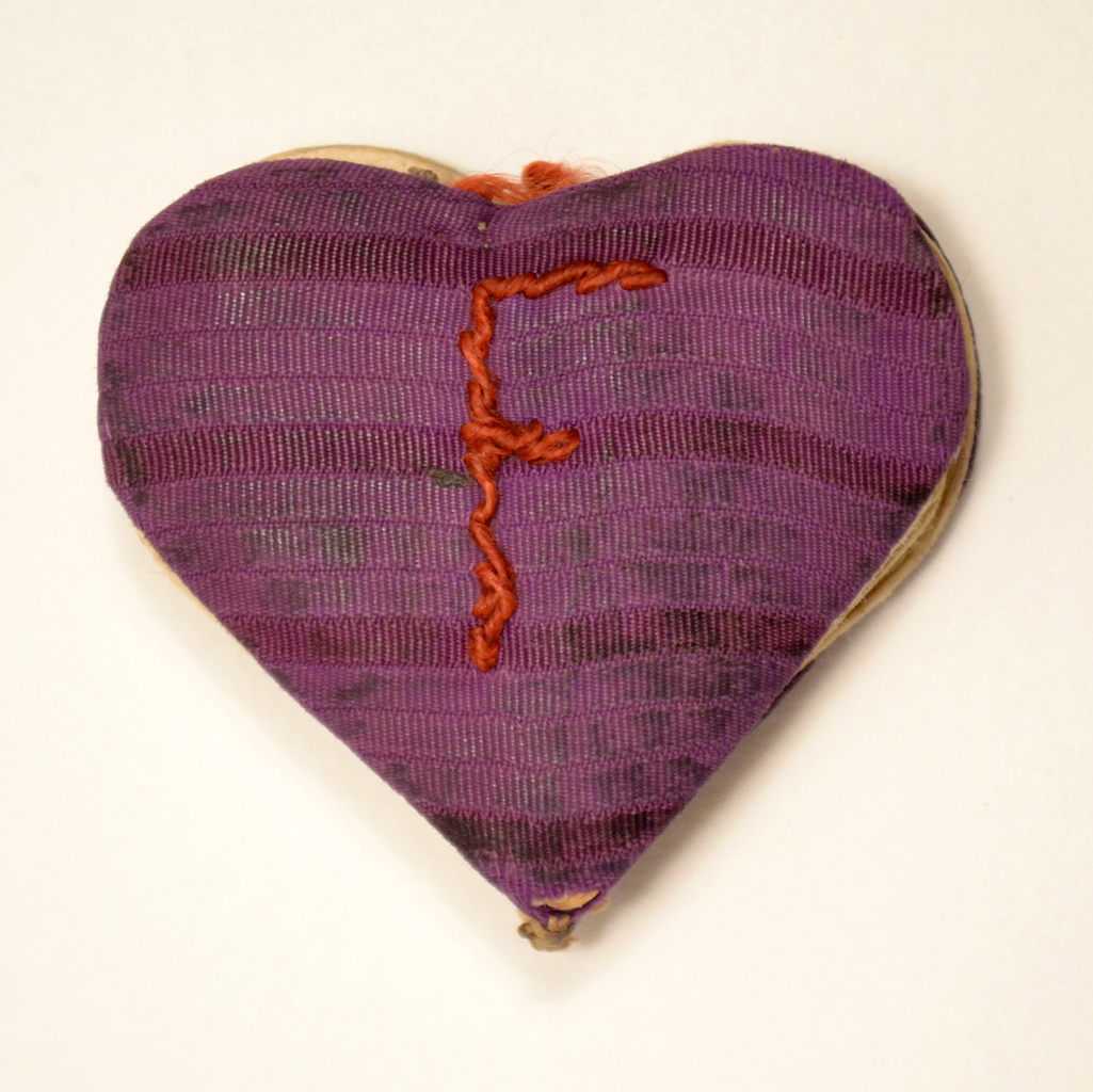 The heart-shaped booklet is a birthday card offered to Fania Fainer for her 20th birthday on December 12, 1944, while she was in Auschwitz.