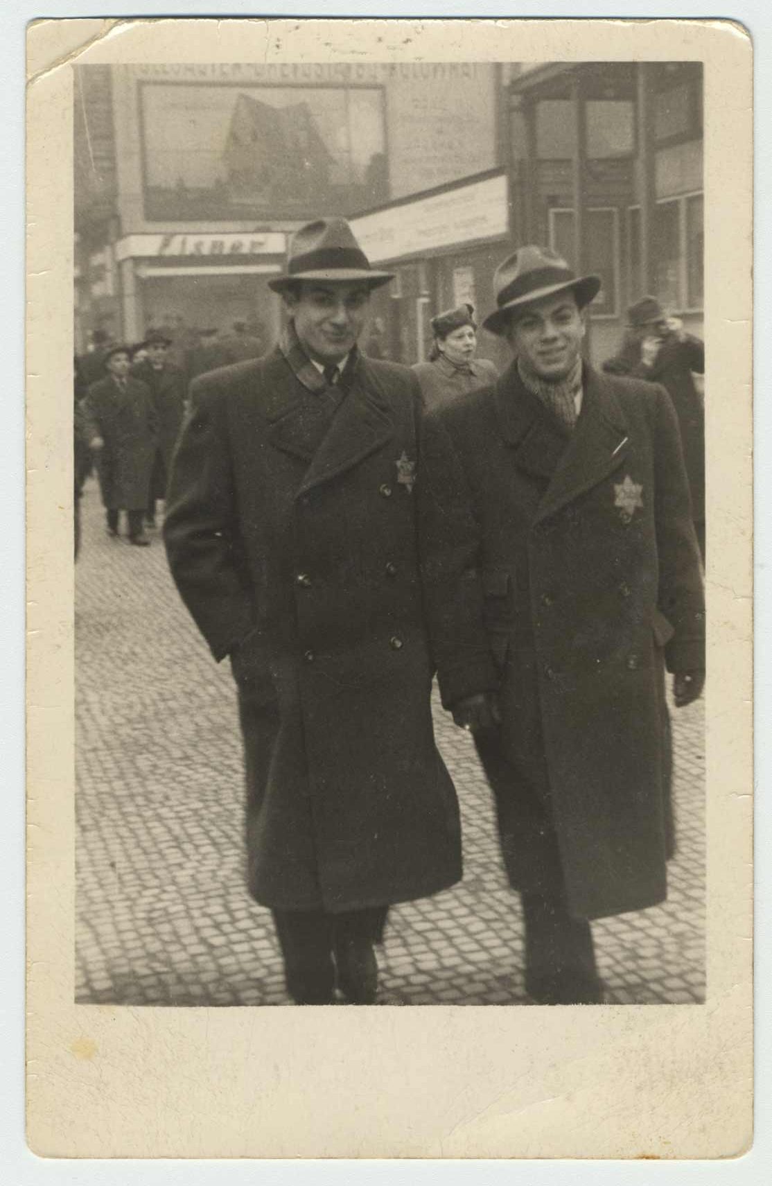 George and Karel Ehrman, photographed on Prikopy street in Prague in 1941. They both wear a yellow star on their coats.