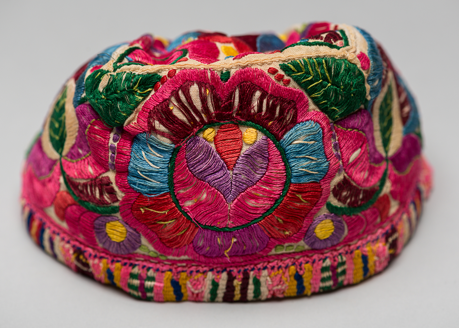 The doll's hat is also intricately embroidered. (Photo: Peter Berra)
